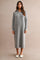 woman wearing a gray knit midi dress with a half-zip collar and long sleeves