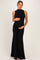 woman wearing a black sleeveless maternity dress with side ruching, holding her baby bump