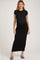 woman wearing a black cap sleeve maternity maxi dress and showcasing her baby bump