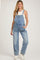 woman wearing a light blue denim maternity overall with wide leg style and side pockets
