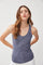 woman wearing a navy blue ribbed tank top with a scoop neckline and relaxed fit