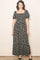 woman wearing a black floral maxi dress with short puff sleeves and a square neckline