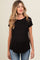woman wearing a black maternity top with short sleeves and a relaxed fit, showing her baby bump
