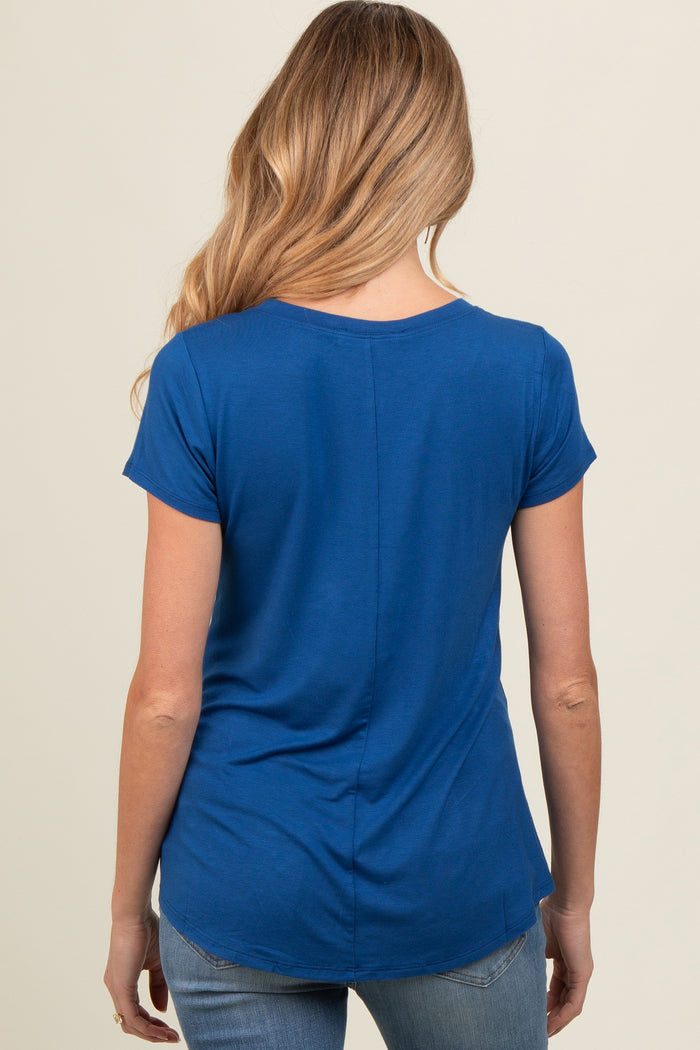 woman wearing a bright blue maternity top with short sleeves and a relaxed fit, showcasing the back view