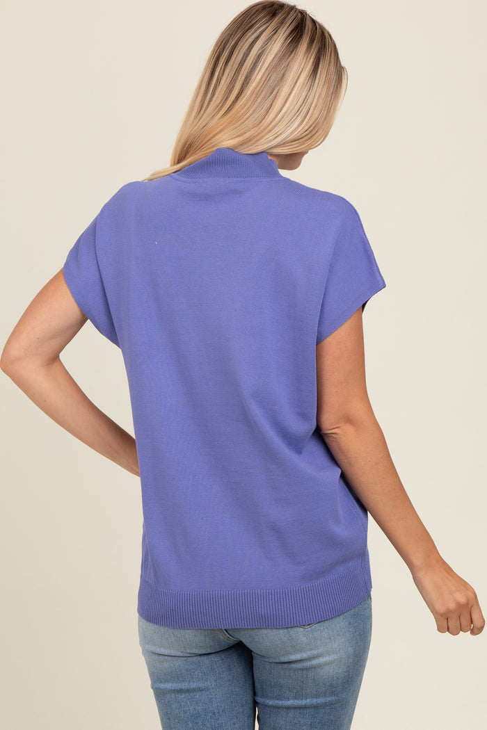 woman wearing a lavender short sleeve sweater with a relaxed fit, seen from the back