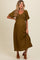 woman wearing an olive green short sleeve maternity dress with a v-neckline and textured fabric, holding her baby bump