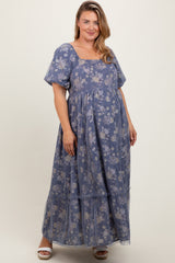 woman wearing a lavender floral maternity dress with short puff sleeves and a tiered skirt, showcasing her baby bump