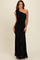 woman wearing a black one-shoulder evening gown with ruching and a flowing skirt