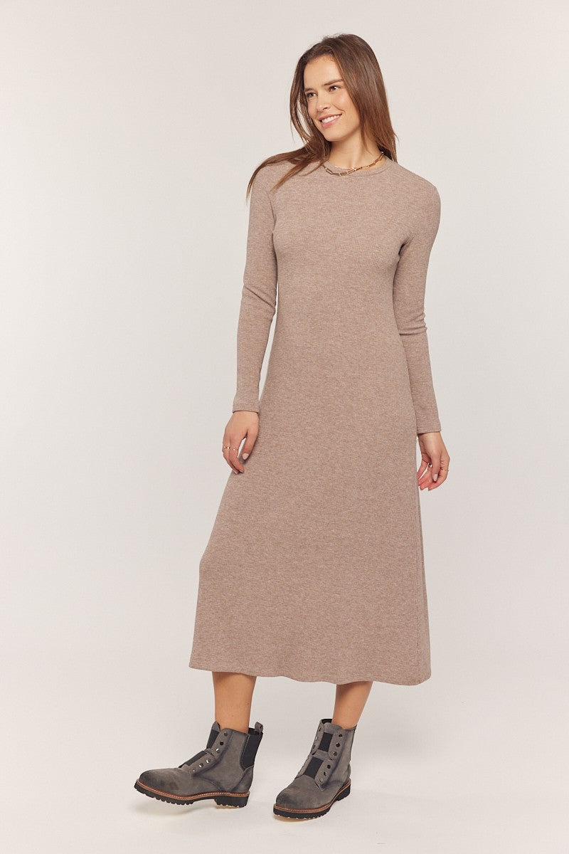 woman wearing a long sleeve beige knit maxi dress and gray ankle boots