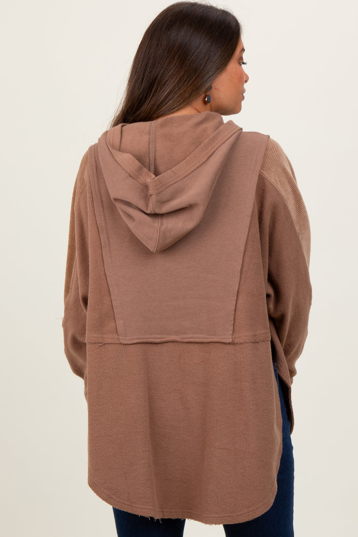 woman wearing a brown maternity hooded cardigan, showing back view with a relaxed fit and soft fabric