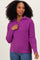 woman wearing a purple zip-up knit sweater with a relaxed fit and ribbed cuffs