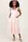 woman wearing a pink and white gingham midi dress with ruffle straps and pockets