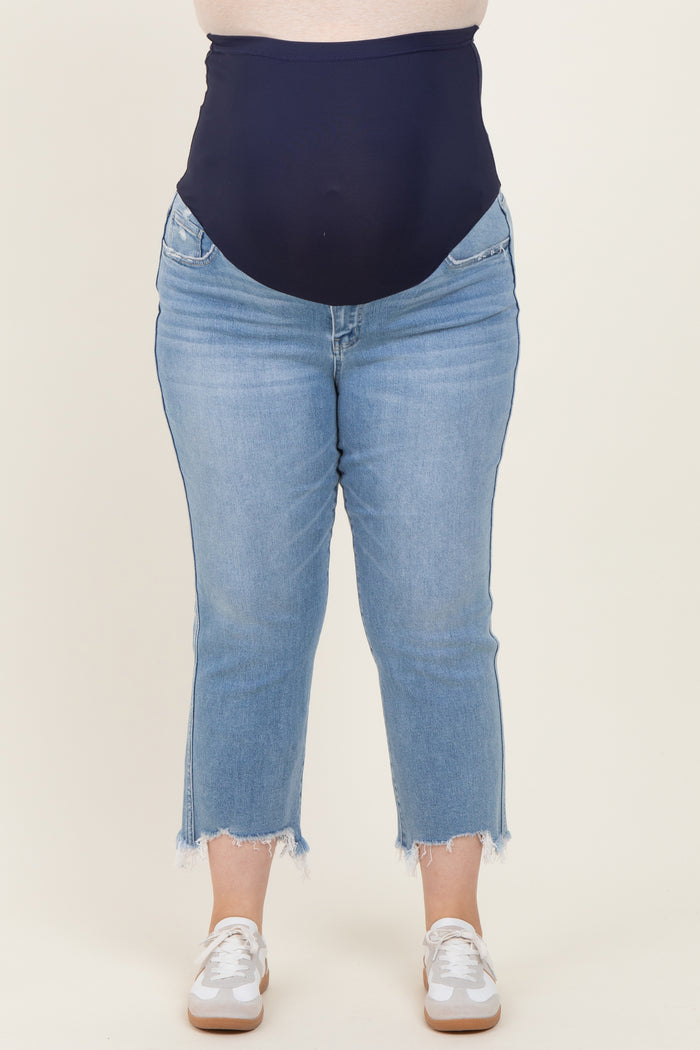 maternity plus high-waisted blue jeans with a stretchy panel for support, styled with frayed hem and worn with white sneakers