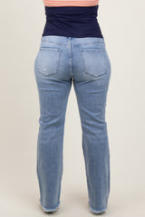 woman wearing light blue maternity plus jeans with a relaxed fit and frayed hem from the back