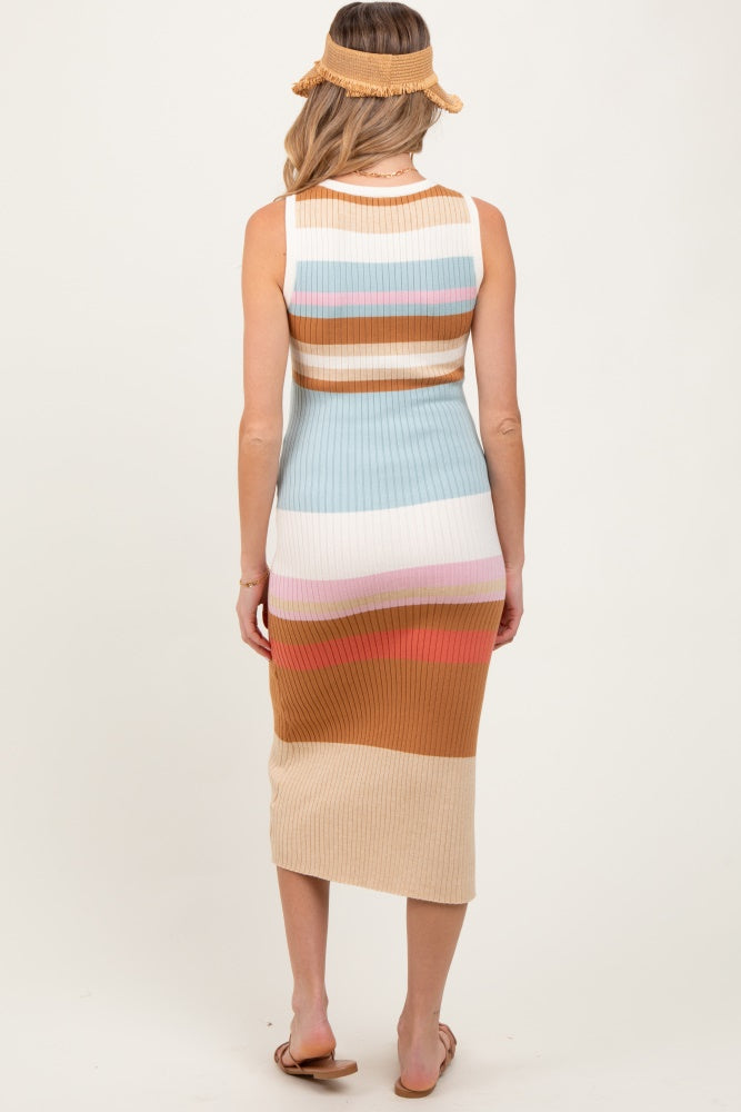 woman wearing a striped maternity dress with pastel colors and ribbed texture, showing a baby bump from the back