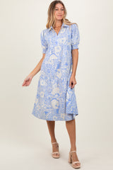 woman wearing a blue floral print midi dress with short puffed sleeves and a button-down front