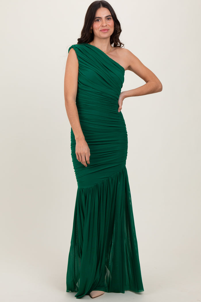 woman wearing a green one-shoulder evening gown with gathered detailing and a flared skirt