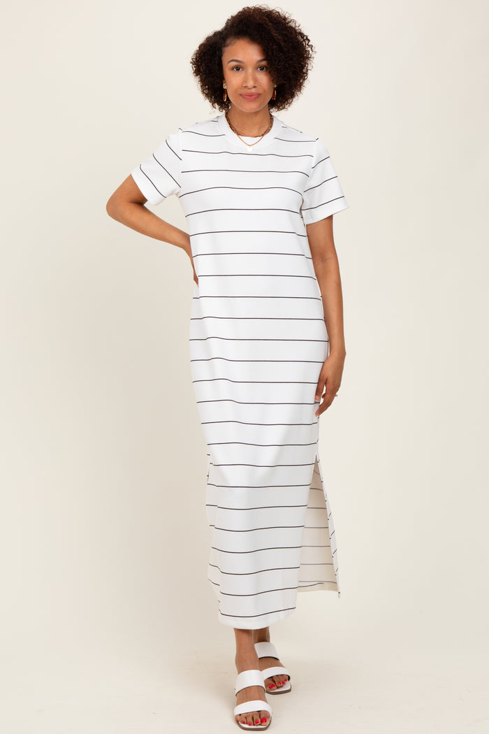 woman wearing a white striped maxi dress with short sleeves and side slits