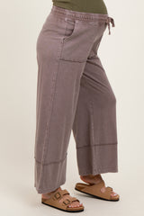 maternity wear wide leg pants in dusty mauve with elastic waistband and drawstring, model showing baby bump
