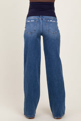woman wearing a pair of maternity wide-leg jeans with a dark blue waistband, seen from the back