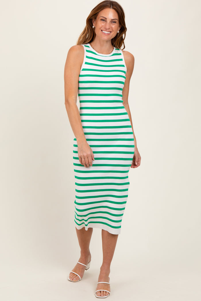 woman wearing a white and green stripe midi dress with a sleeveless design and a fitted silhouette