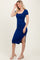 woman wearing a royal blue ribbed midi dress with short sleeves and a side slit