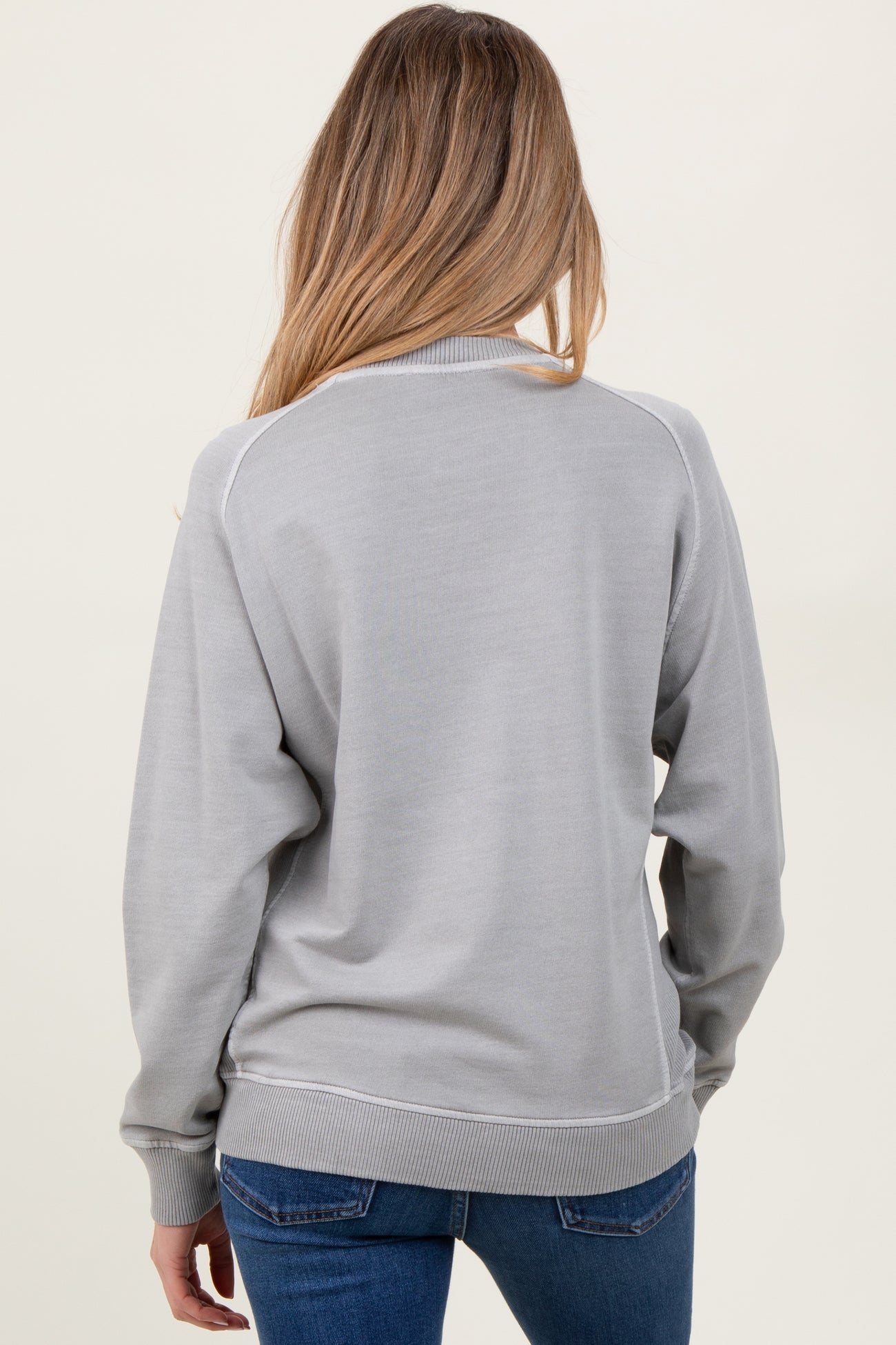 woman wearing a gray maternity sweatshirt with ribbed cuffs and hem, viewed from the back