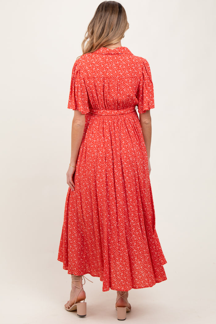 woman wearing a red floral print maternity dress with short sleeves and a tie waist, shown from the back