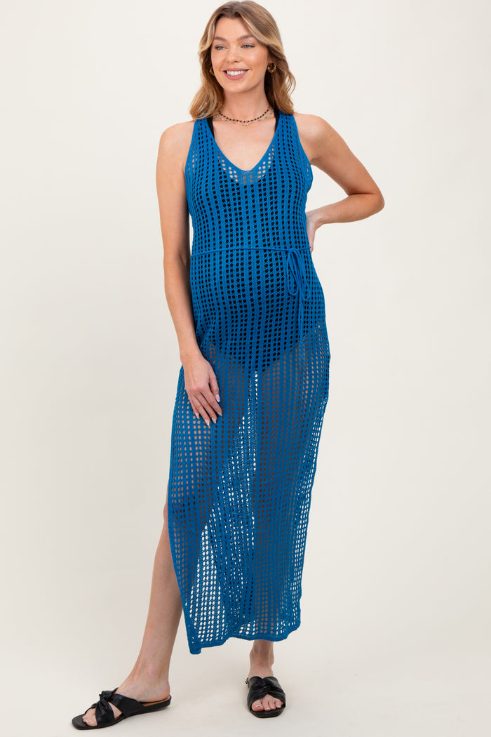 woman wearing a blue maternity cover-up dress with a v-neck and side tie, showcasing her baby bump