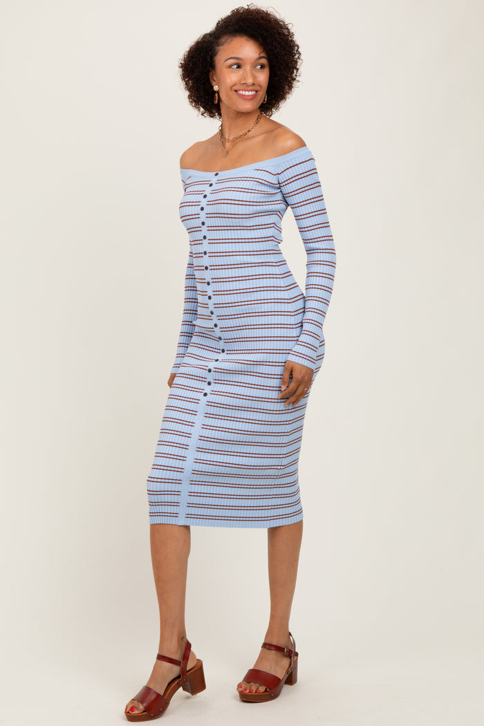 woman wearing a light blue off-shoulder striped midi dress with button details and sandals