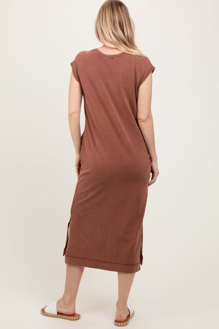 woman wearing a brown midi dress with cap sleeves and side slits, shown from the back