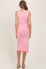 woman wearing a pink and white striped midi dress with ruffle hem and a fitted silhouette, viewed from the back