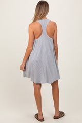 woman wearing a light gray striped sleeveless maternity dress with a relaxed fit, seen from the back