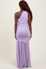 woman wearing a lavender one-shoulder evening gown with ruched detailing and a flowing skirt