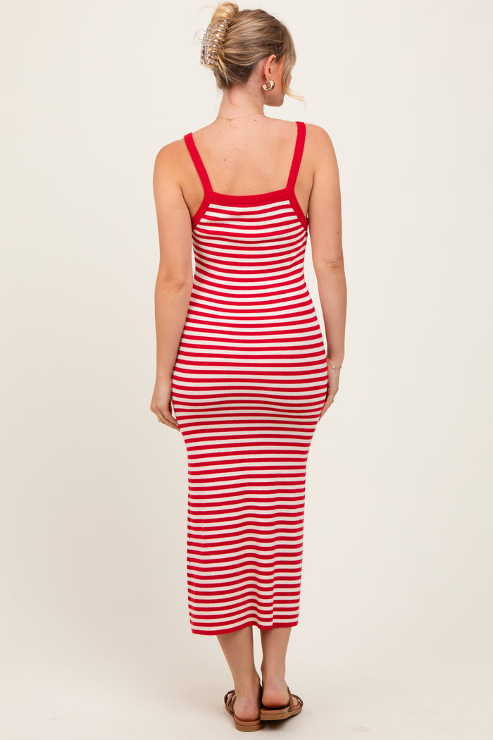 woman wearing a red and white striped midi dress with a fitted silhouette and spaghetti straps, seen from the back