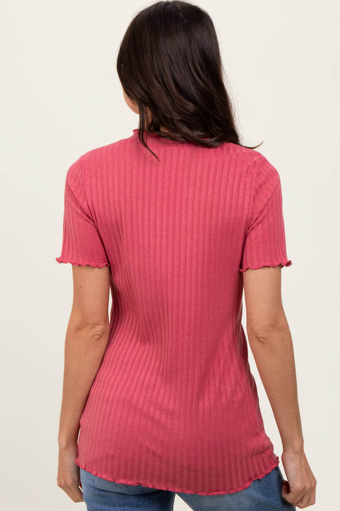 woman wearing a pink ribbed t-shirt with short sleeves and a scalloped hem, seen from the back