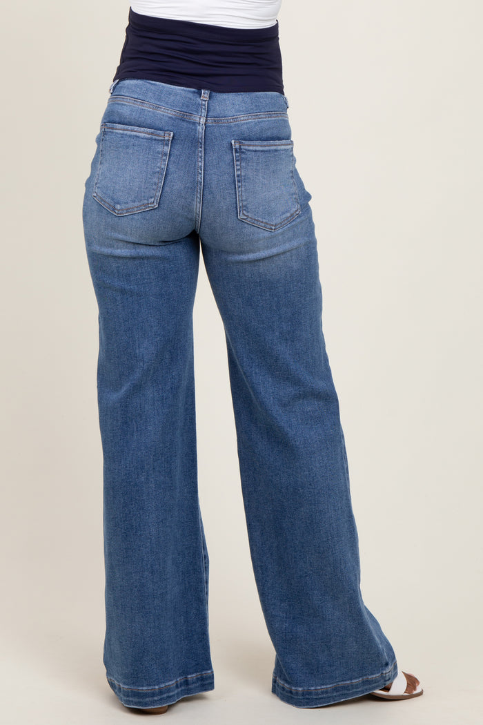 woman wearing blue wide-leg maternity jeans showing the back view