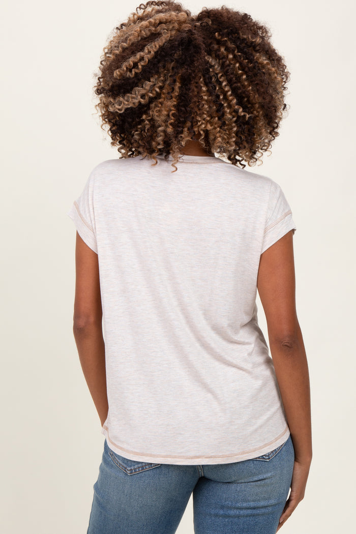 woman wearing a light gray maternity t-shirt with rolled sleeves, viewed from the back