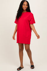 woman wearing a vibrant red short sleeve t-shirt dress with a relaxed fit and black slide sandals