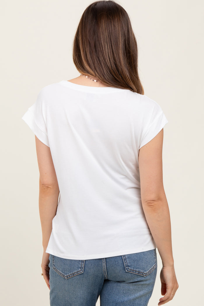 woman wearing a white short sleeve maternity top, showing the back view with relaxed fit and rolled sleeves
