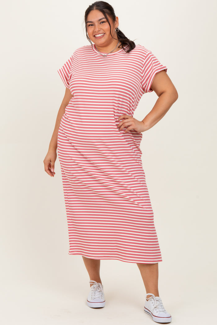 woman wearing a red and white striped plus size midi dress with short sleeves and a relaxed fit