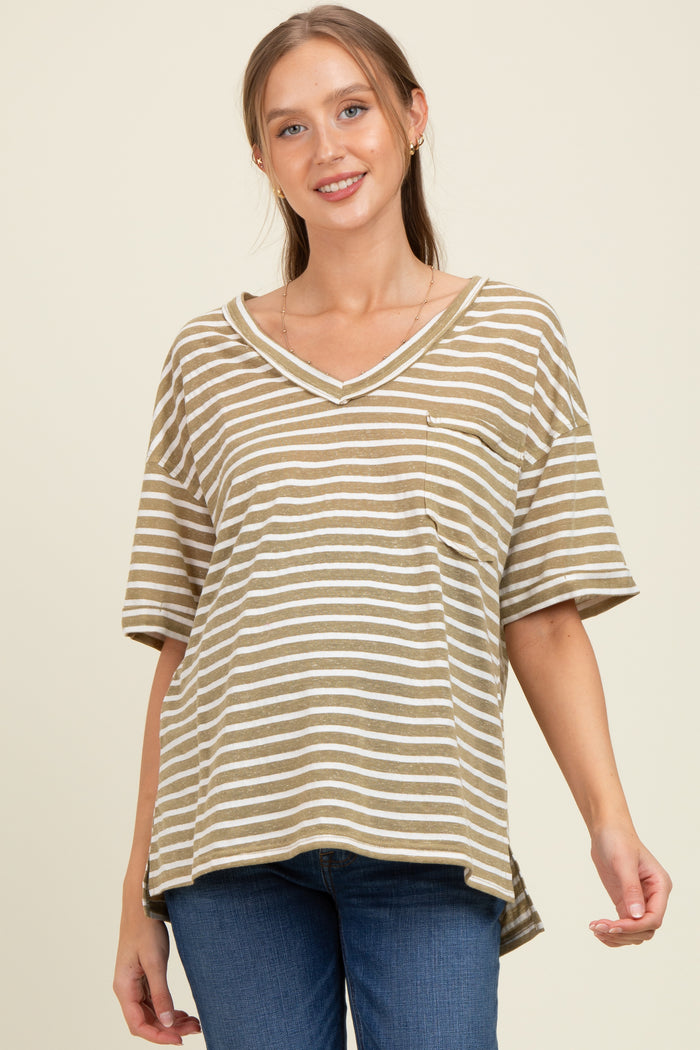 woman wearing a striped maternity top in olive green and white with a v-neck and side slits, smiling at the camera