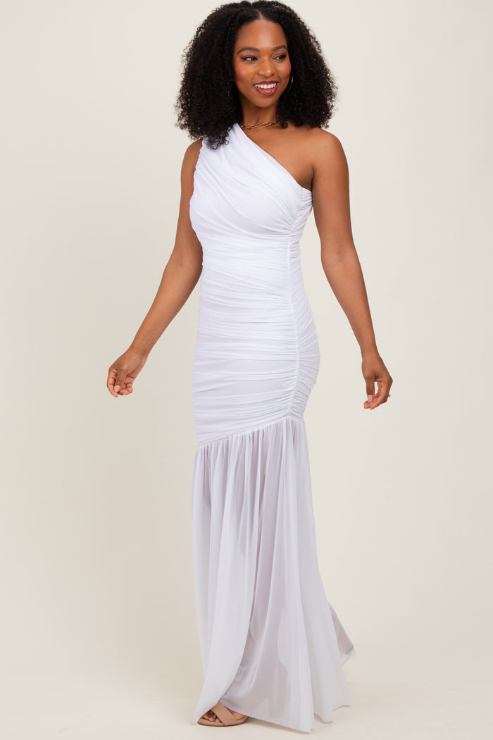 woman wearing a white one-shoulder evening gown with ruched details and a flared skirt