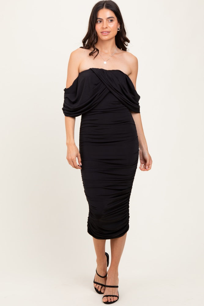 woman wearing a black off-shoulder bodycon dress with ruched detailing and mid-length hemline