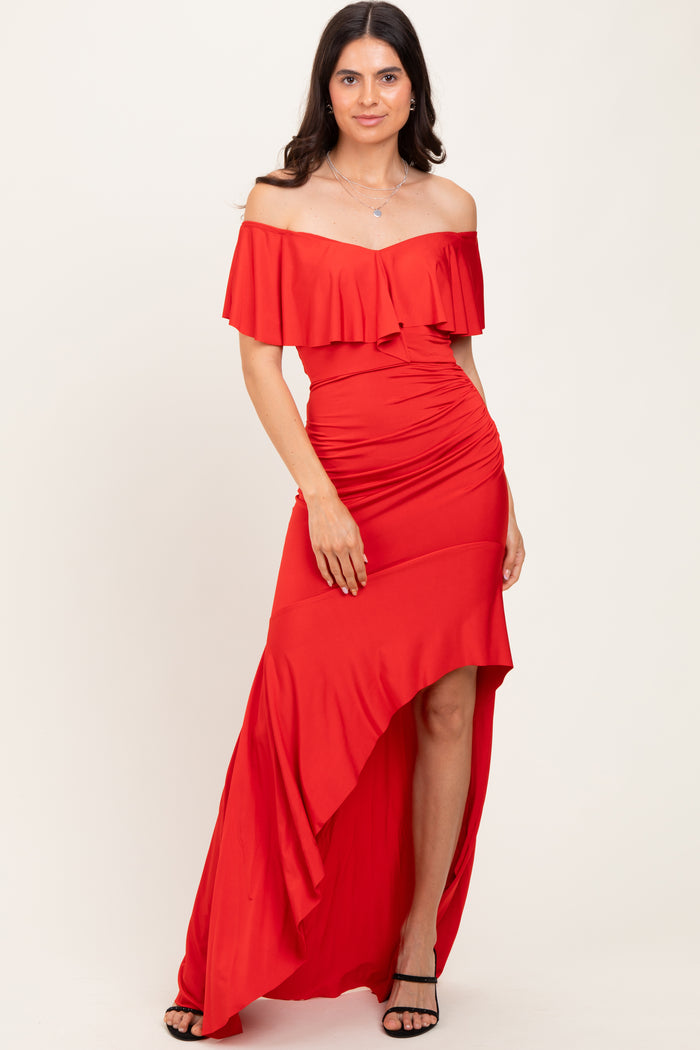 woman wearing a red off-the-shoulder dress with ruffle details and a high-low hemline