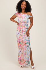 woman wearing a colorful floral off-the-shoulder maxi dress with a side slit and a fitted silhouette