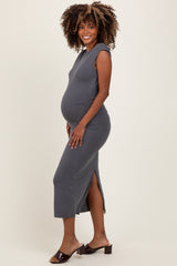 woman wearing a gray maternity dress with side slits and a visible baby bump