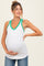 woman wearing a white maternity tank top with green trim and floral pattern, showing her baby bump