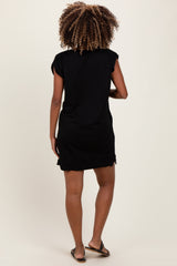 woman wearing a black maternity dress with short sleeves, showing a relaxed fit from the back