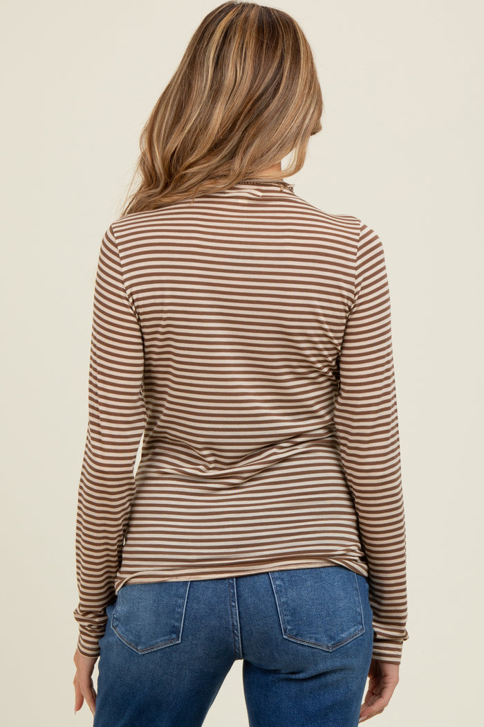 woman wearing a brown and beige striped maternity long sleeve top, viewed from the back